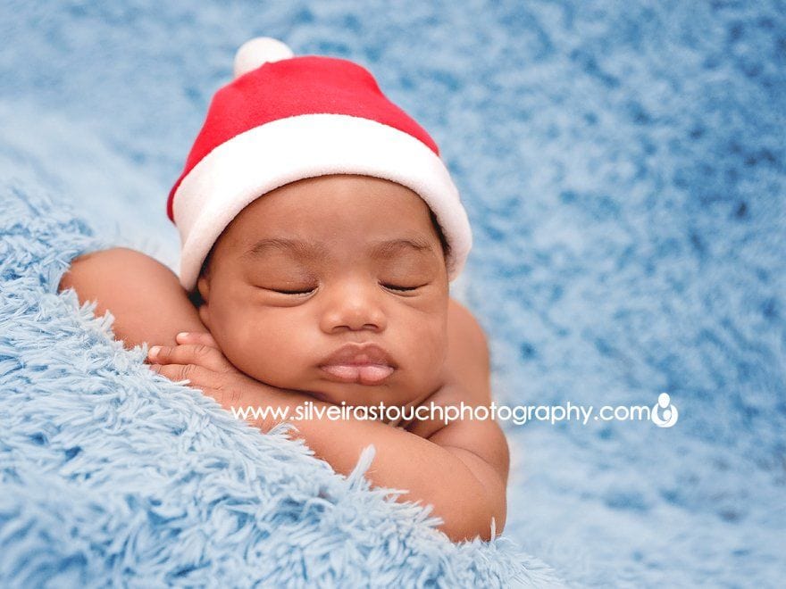 sleepy baby boy in santa hat