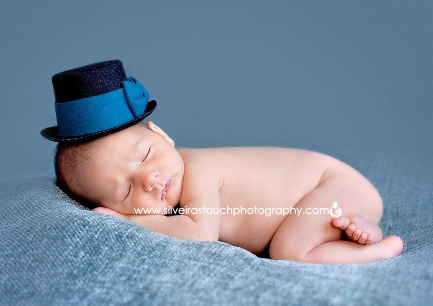 cute baby in dapper hat posing
