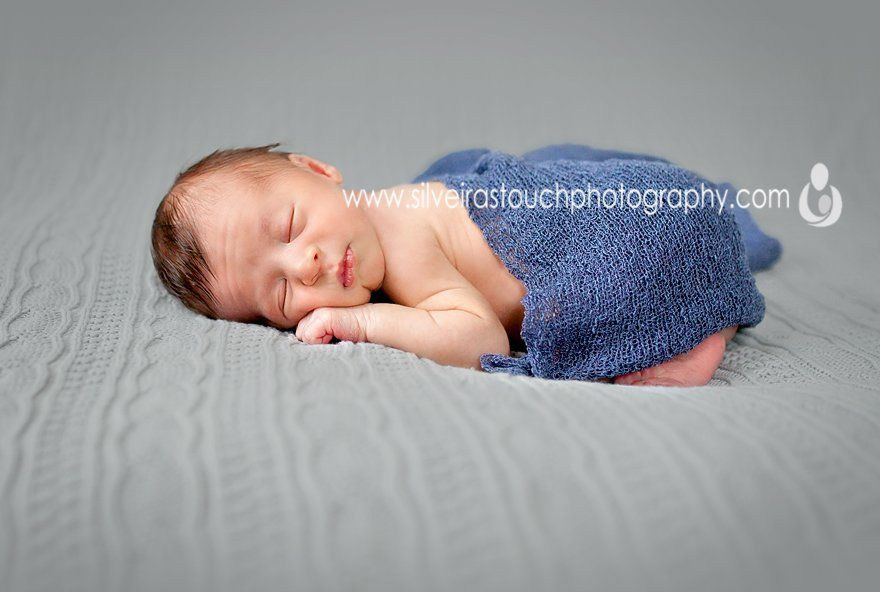 photo of baby boy sleeping on blanket