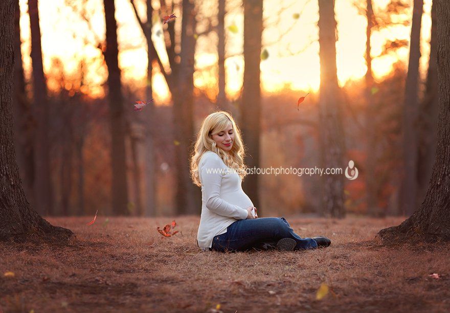 Verona NJ Maternity photography of pregnant mom sitting on ground with sunset behind her.