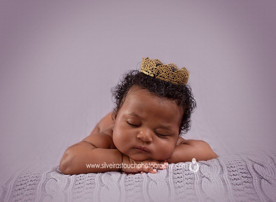 newborn girl wearing tiara