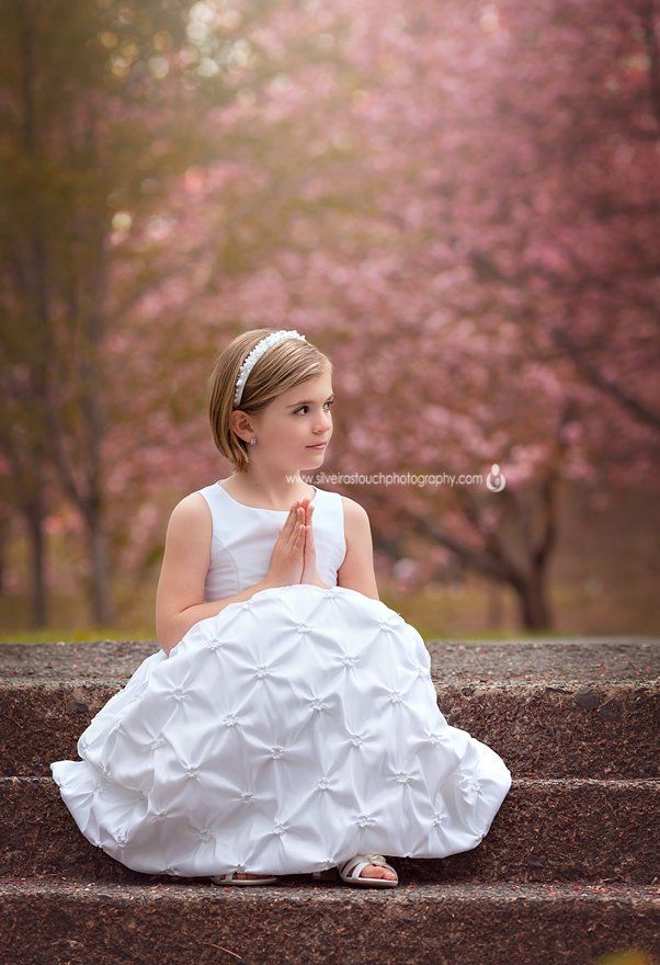 Communion Photography of girl sitting on steps NJ cherry blossoms