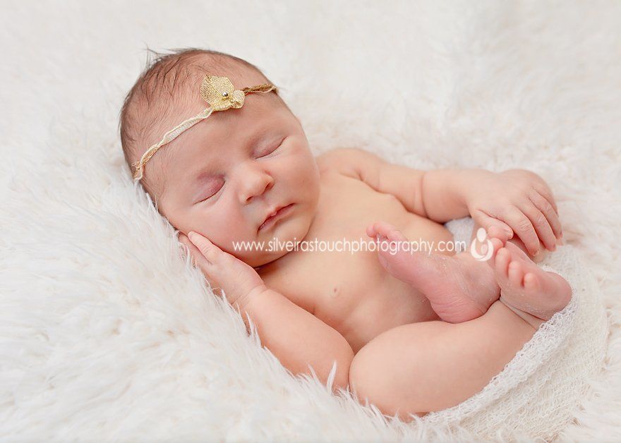 sleeping newborn hand on face