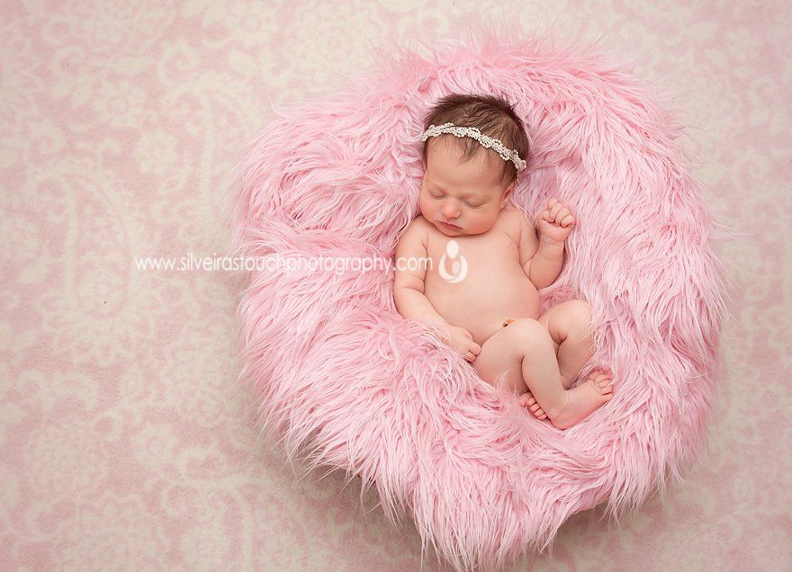 Livingston NJ newborn photography of baby girl laying on pink fur prop