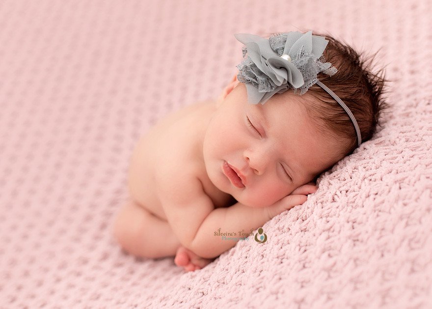 roseland NJ newborn photographer capturing baby on pink blanket sleeping