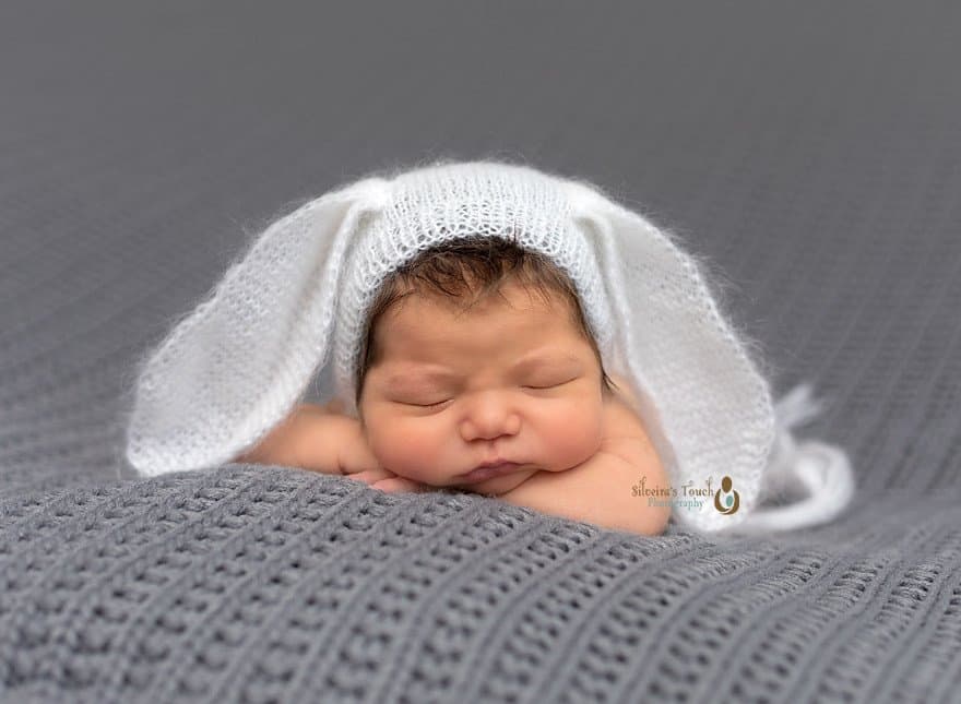 Newborn photography of baby wearing bunny hat