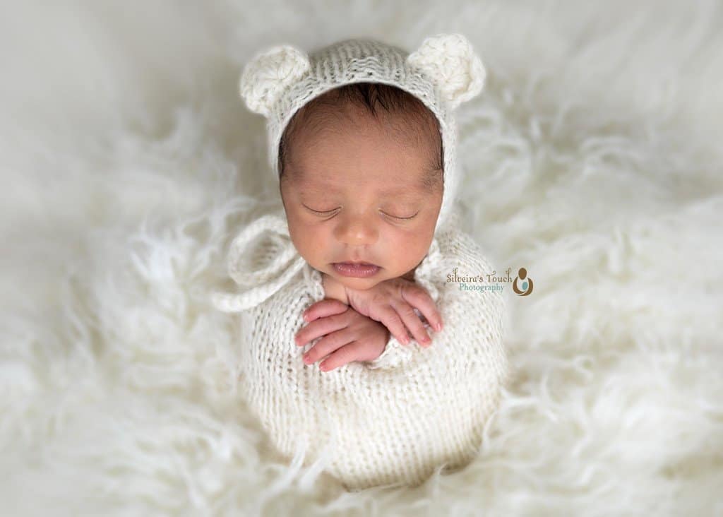 Budd Lake NJ Newborn photography of baby in potato sack pose sleeping on bean bag