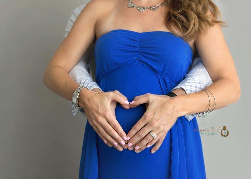 Maternity couple portrait taken with heart shape love