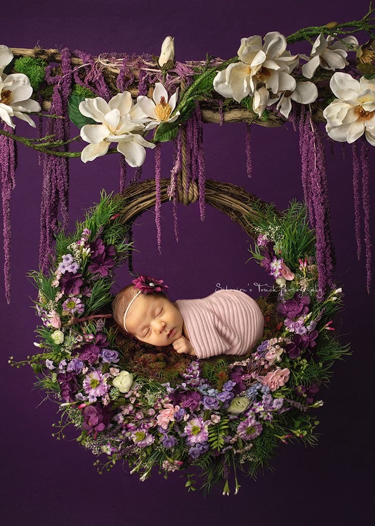 baby photography on flower swing