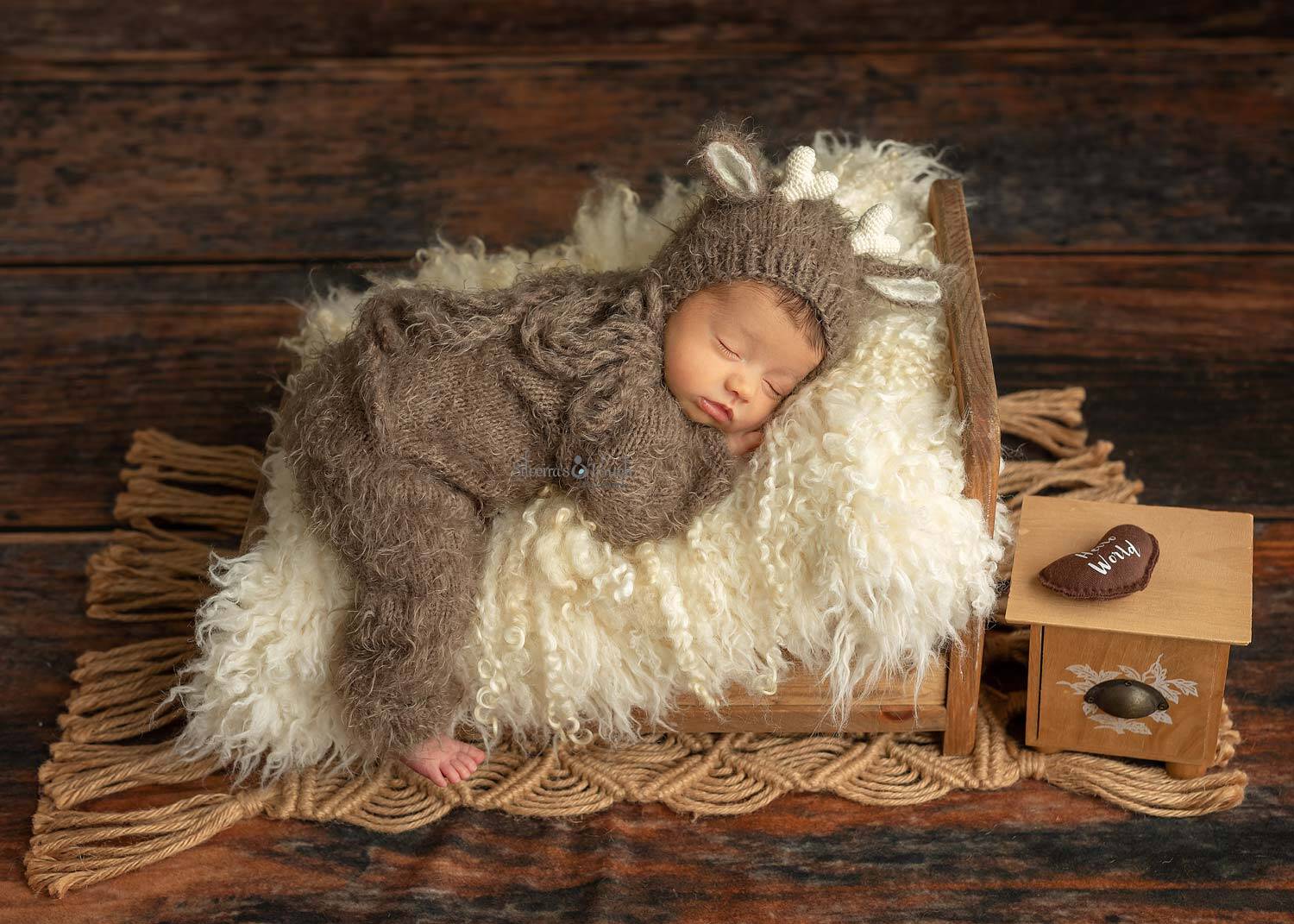 Baby boy sleepy on bed prop
