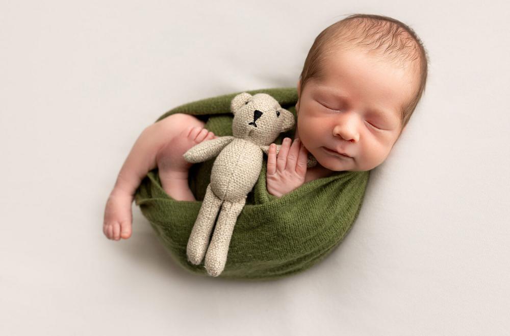 swaddled newborn with bear photography NJ