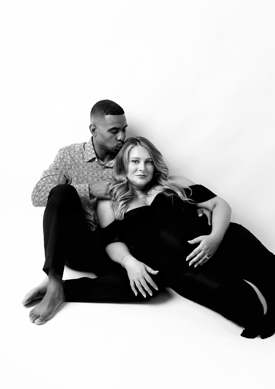 Dover NJ pregnancy photo shoot studio, couple dressed elegant sitting on floor 
