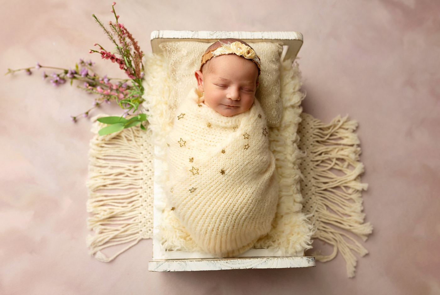 baby girl photo on bed