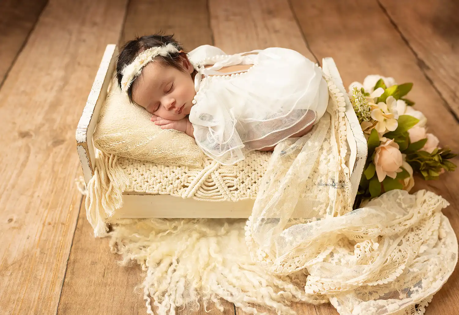 newborn girl on bed photographs