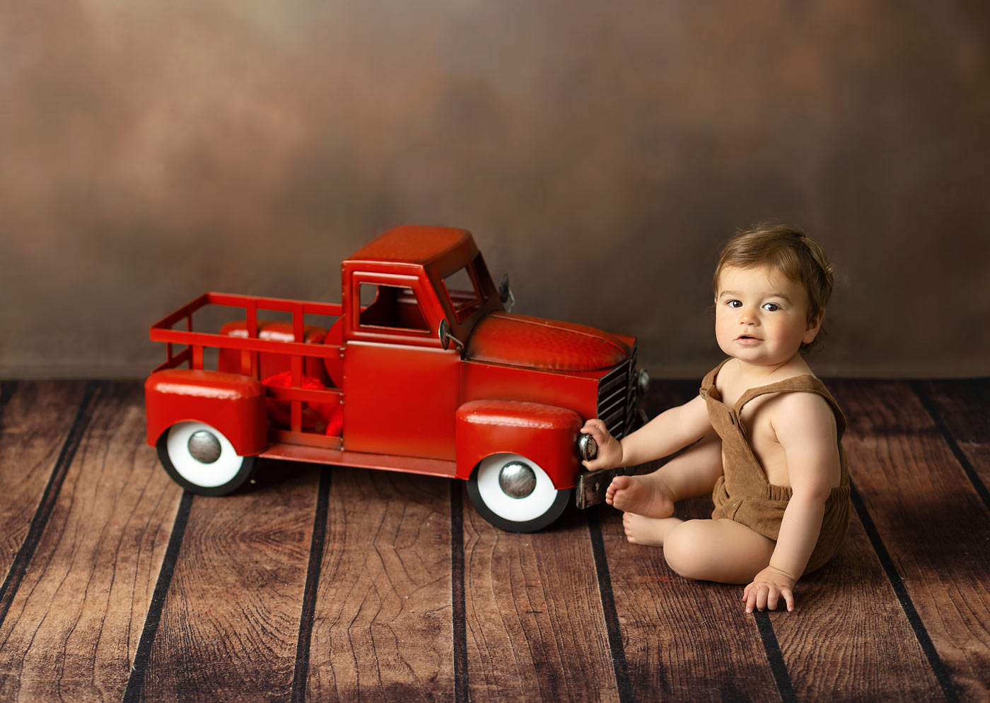 baby boy and red truck photo